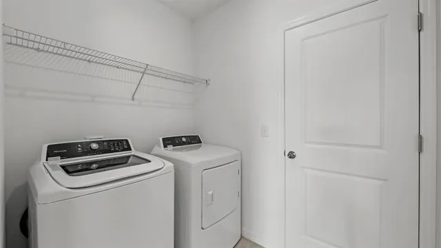 a utility room with dryer and washer