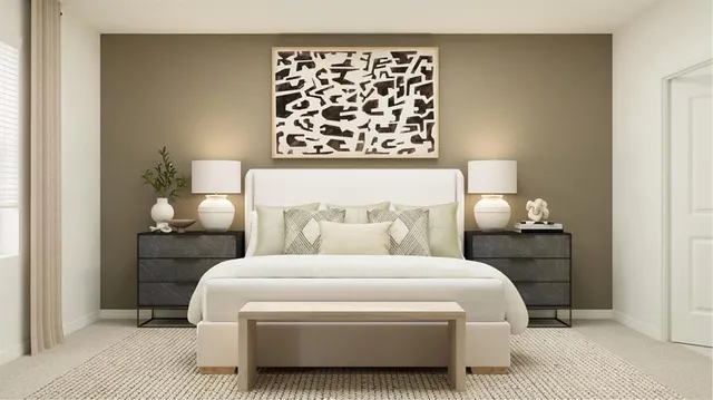 a bedroom with a bed and a lamp on dresser