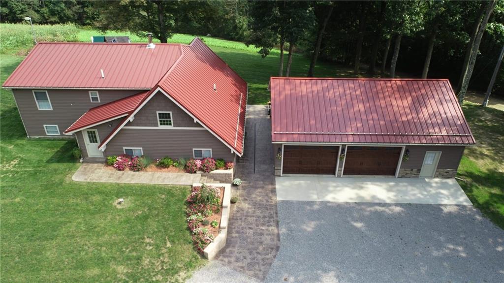 1213 Sunol Road Cochranton, PA 16314 - Photo 1 of 25 a front view of a house with a yard