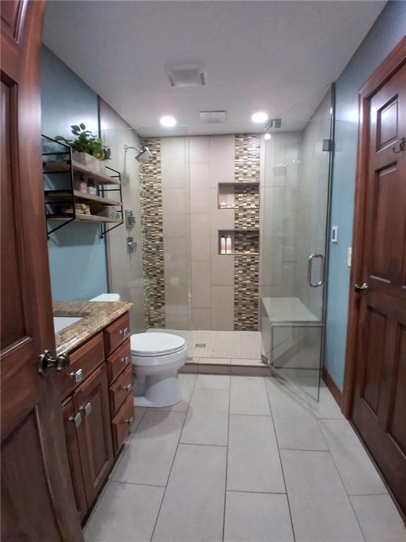 1213 Sunol Road Cochranton, PA 16314 - Photo 17 of 25 a bathroom with a toilet a sink and shower