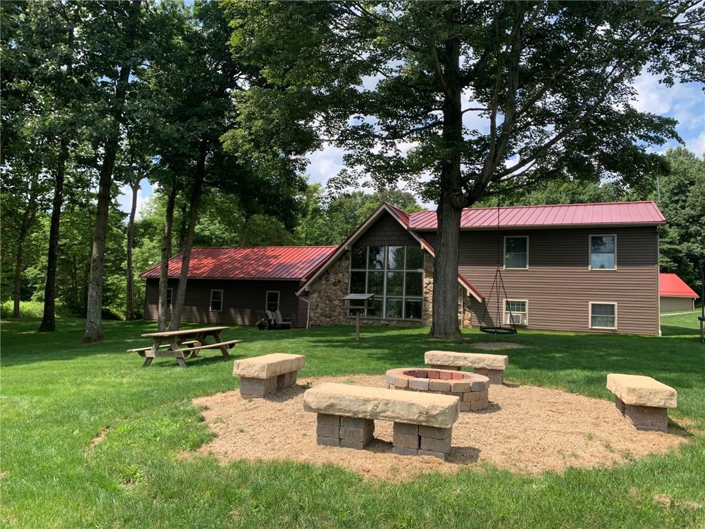 1213 Sunol Road Cochranton, PA 16314 - Photo 4 of 25 a front view of a house with a yard table and chairs