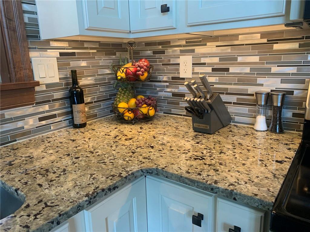 1213 Sunol Road Cochranton, PA 16314 - Photo 8 of 25 a kitchen with a stove and cabinets