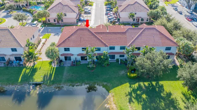 an aerial view of a house with swimming pool garden and patio