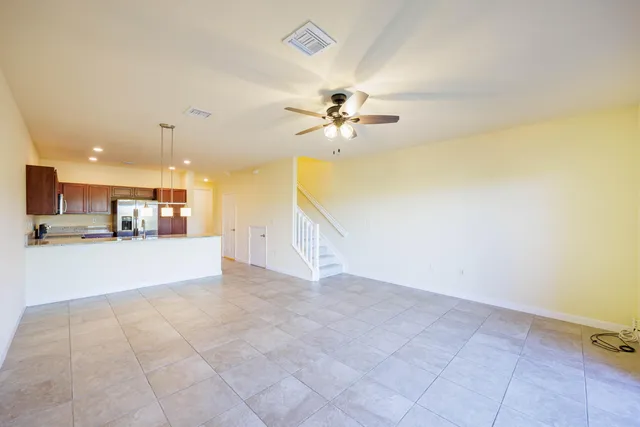 a view of a kitchen with a stove and a kitchen view