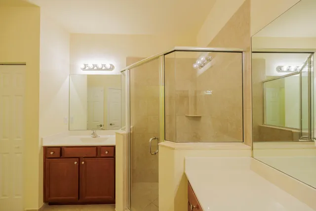a bathroom with a shower and a sink
