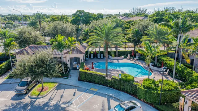 an aerial view of a house with swimming pool