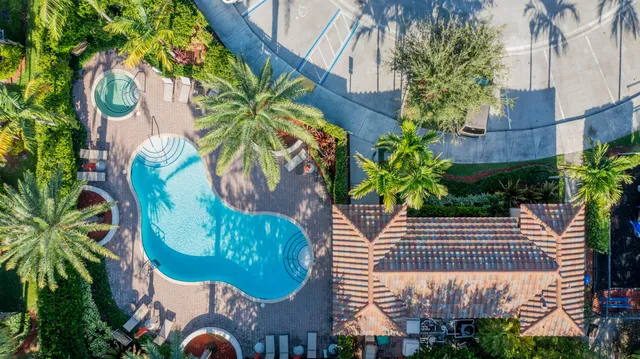 a view of a house with a flower garden