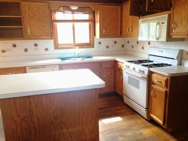 4852 Snapjack Circle Naperville, IL 60564 - Photo 2 of 8 a kitchen with granite countertop a sink stove and cabinets