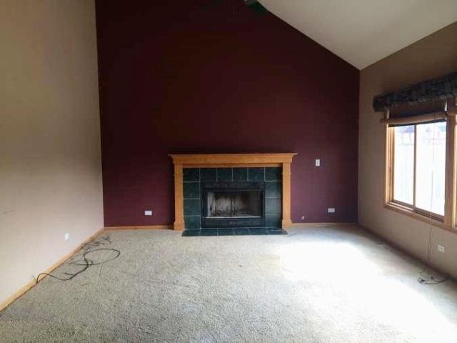4852 Snapjack Circle Naperville, IL 60564 - Photo 3 of 8 an empty room with a fireplace and window