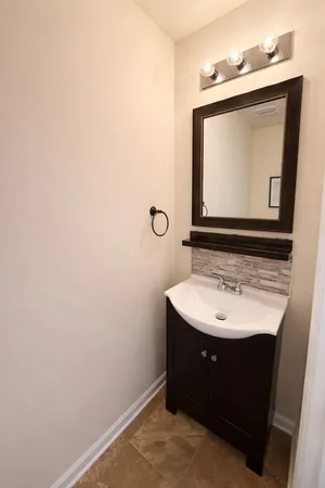 a white toilet sitting next to a shower