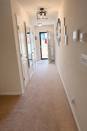 a view of a hallway with closet area