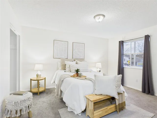 a room with a bed and lamp