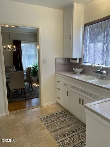 a view of hallway with furniture