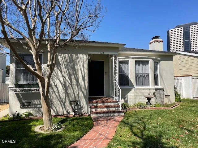 front view of a house with a yard