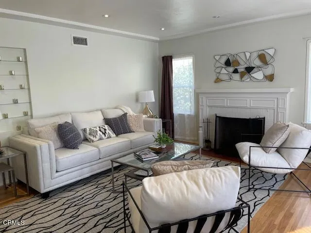 a living room with furniture and a fireplace