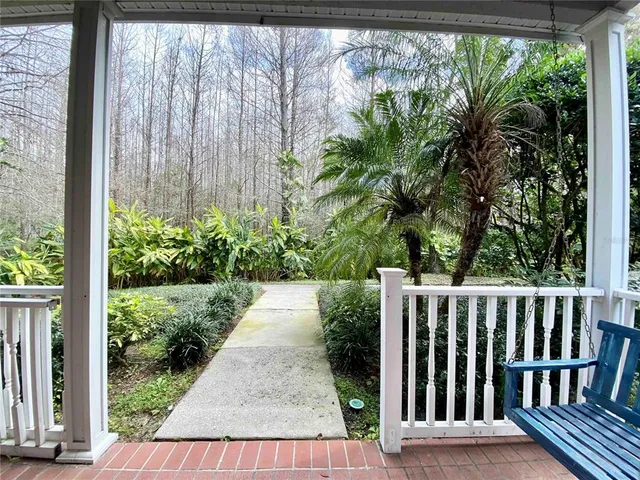 a view of a back yard from a patio