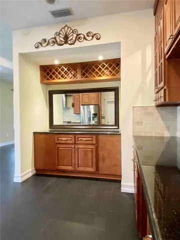 a view of kitchen with wooden floor