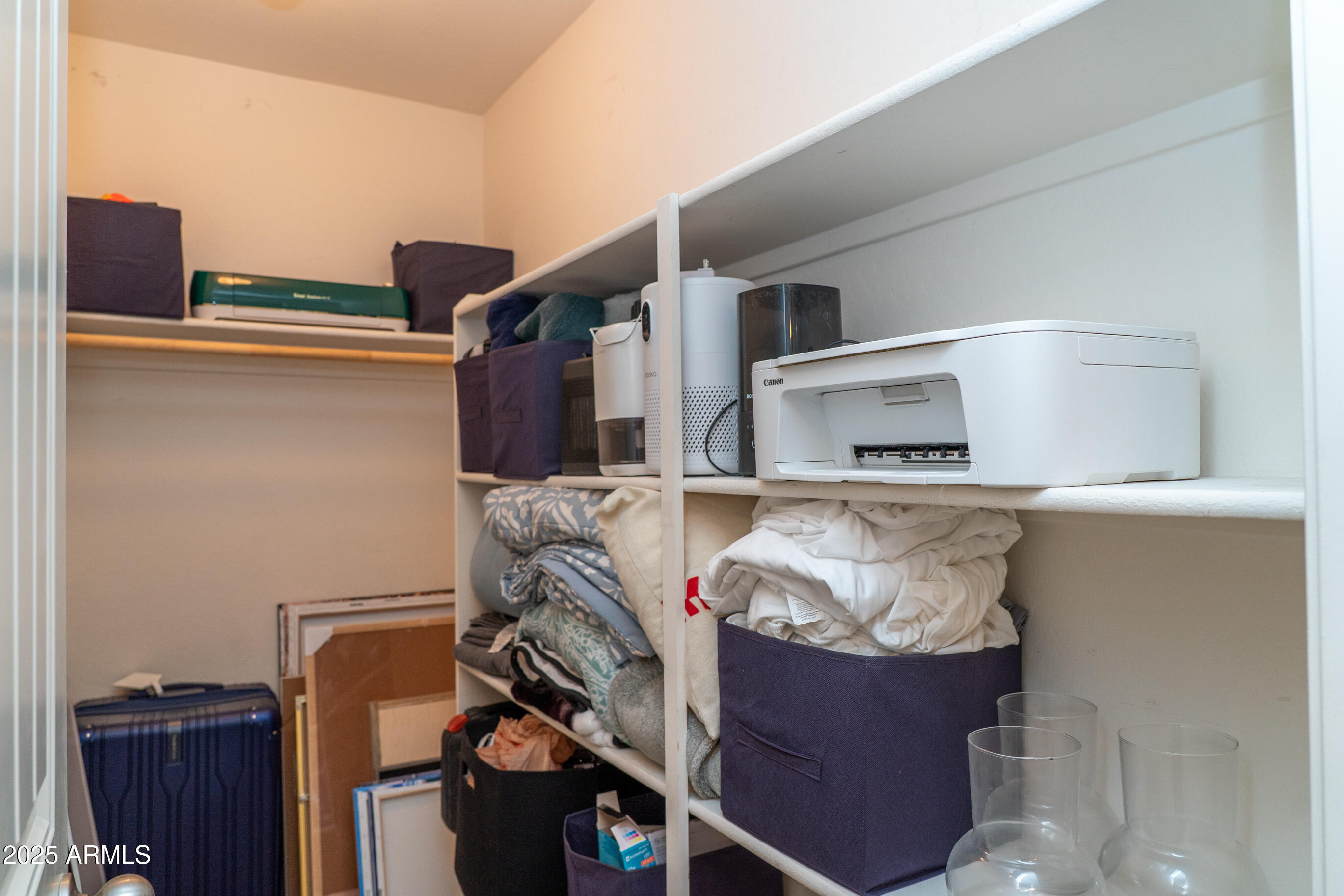 10225 West Camelback Road, Unit 45 Phoenix, AZ 85037 - Photo 23 of 29 Upstairs hall walk in closet