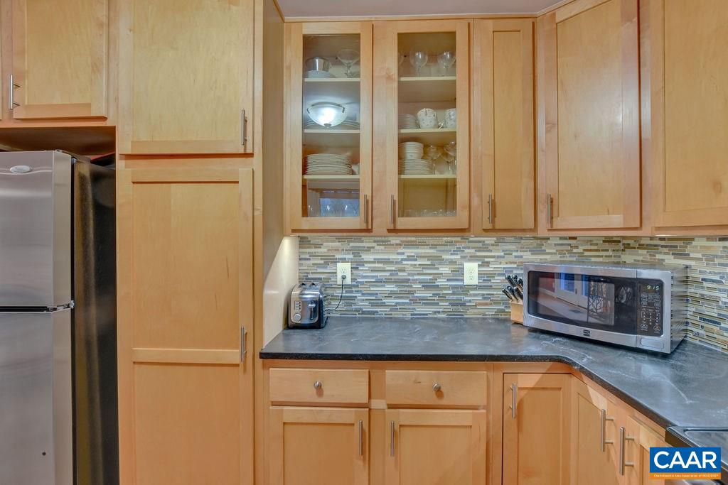 2421 Huntington Road Charlottesville, VA 22901 - Photo 13 of 40 a kitchen with stainless steel appliances granite countertop a refrigerator and a sink