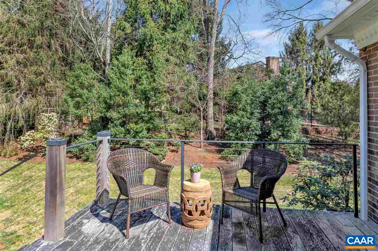 2421 Huntington Road Charlottesville, VA 22901 - Photo 35 of 40 a view of a chairs and table in a backyard