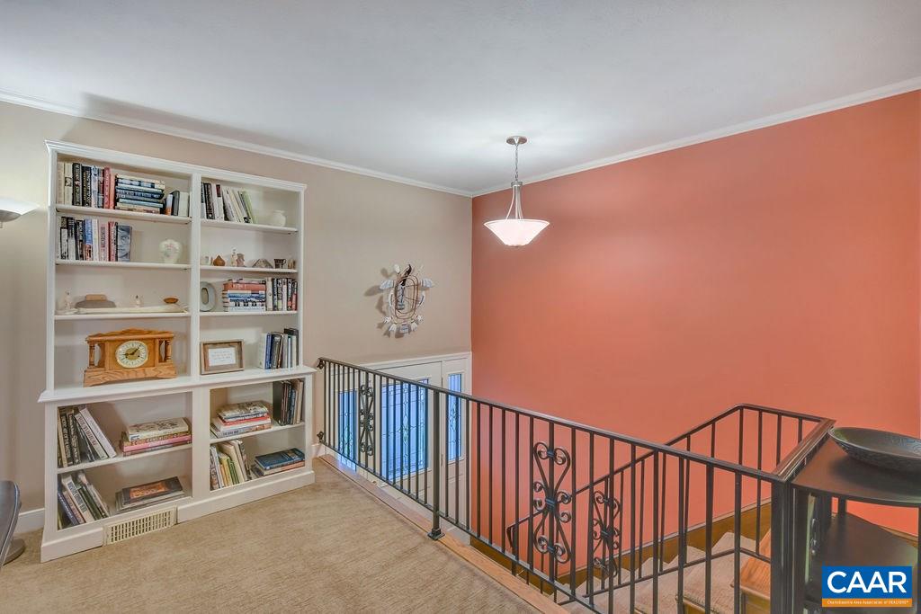 2421 Huntington Road Charlottesville, VA 22901 - Photo 5 of 40 a view of a hallway with bookshelf