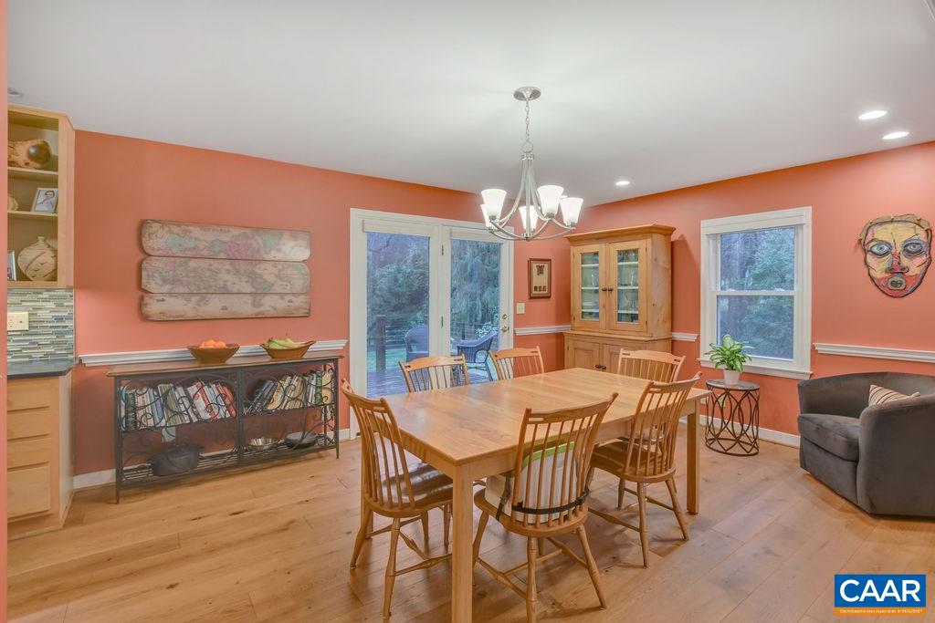 2421 Huntington Road Charlottesville, VA 22901 - Photo 10 of 40 a view of a dining room with furniture window and wooden floor