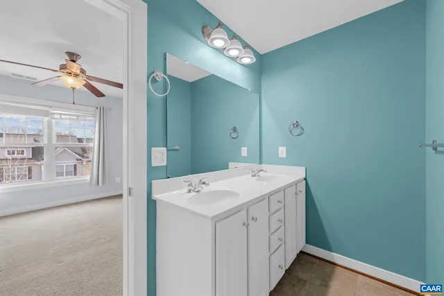 a bathroom with a sink a vanity and a mirror
