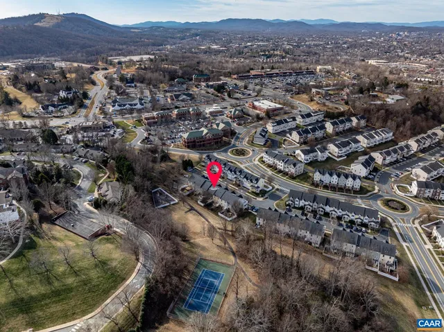 an aerial view of residential house and sandy dunes