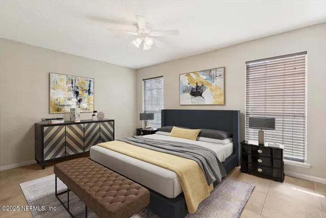 a bedroom with bed and night stand