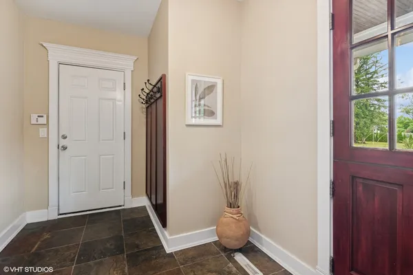 a close view of a utility room with dryer and washer