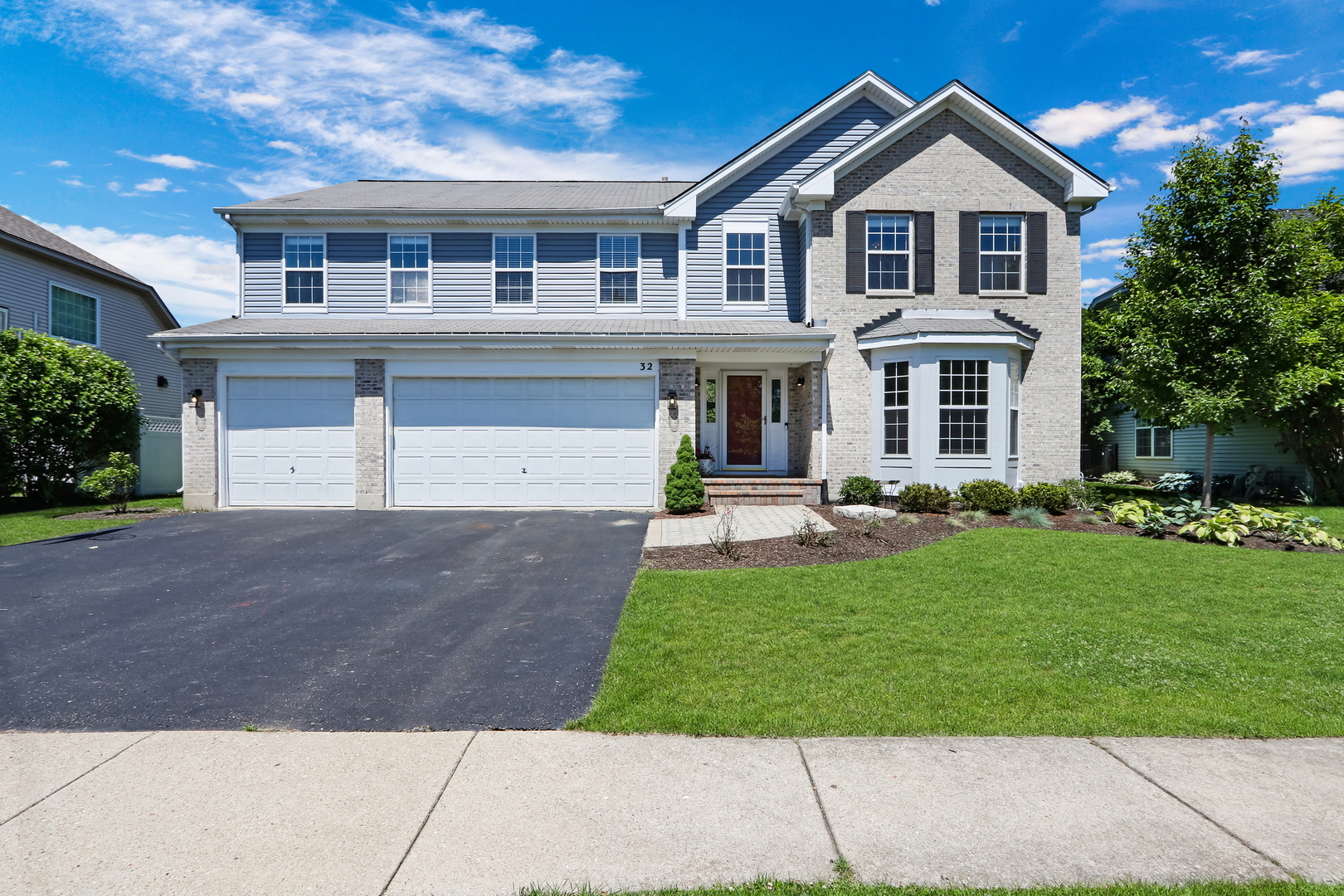32 Highland Road Grayslake, IL 60030 - Photo 1 of 39 a front view of a house with a yard
