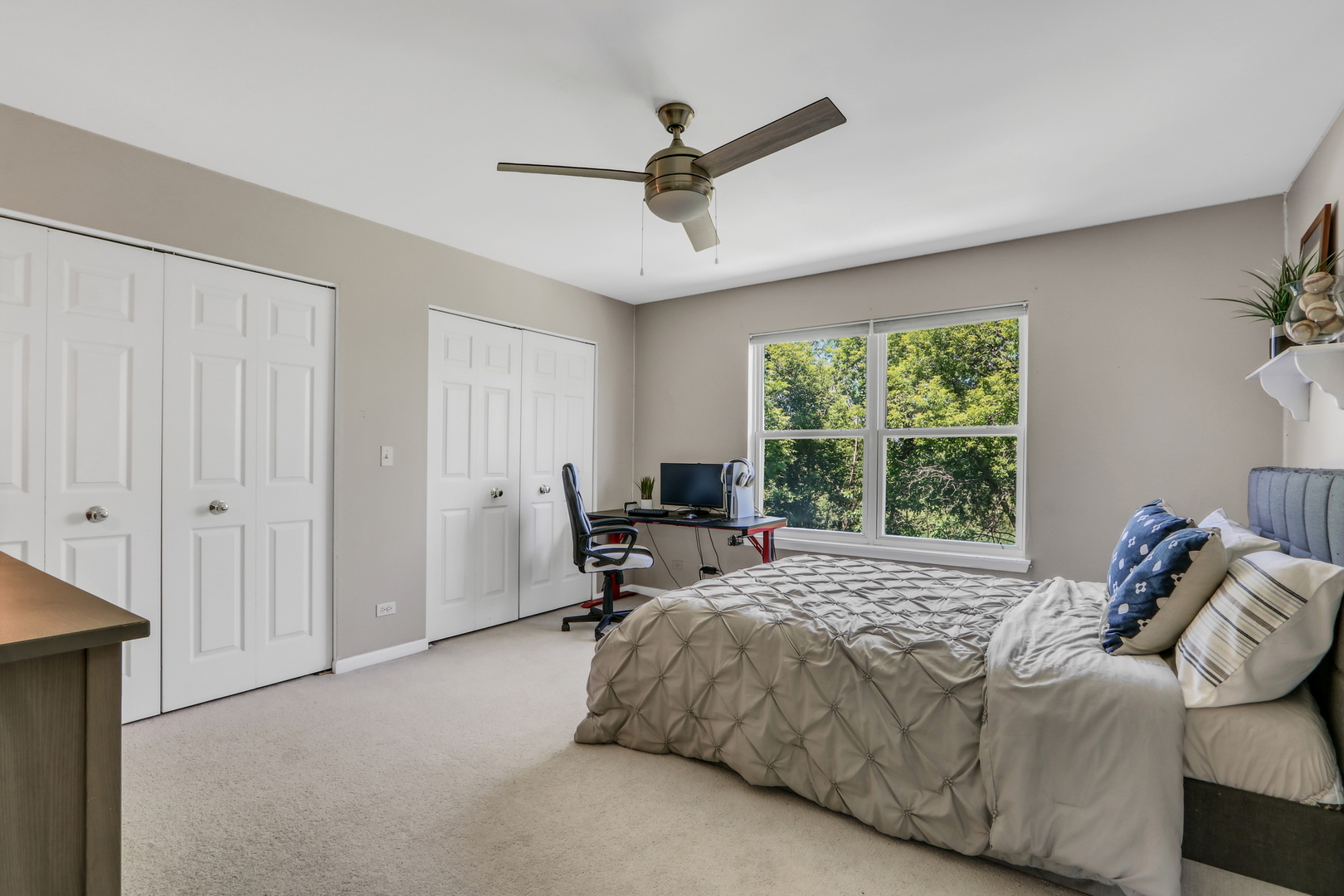 32 Highland Road Grayslake, IL 60030 - Photo 26 of 39 a bed sitting in a bedroom next to a window