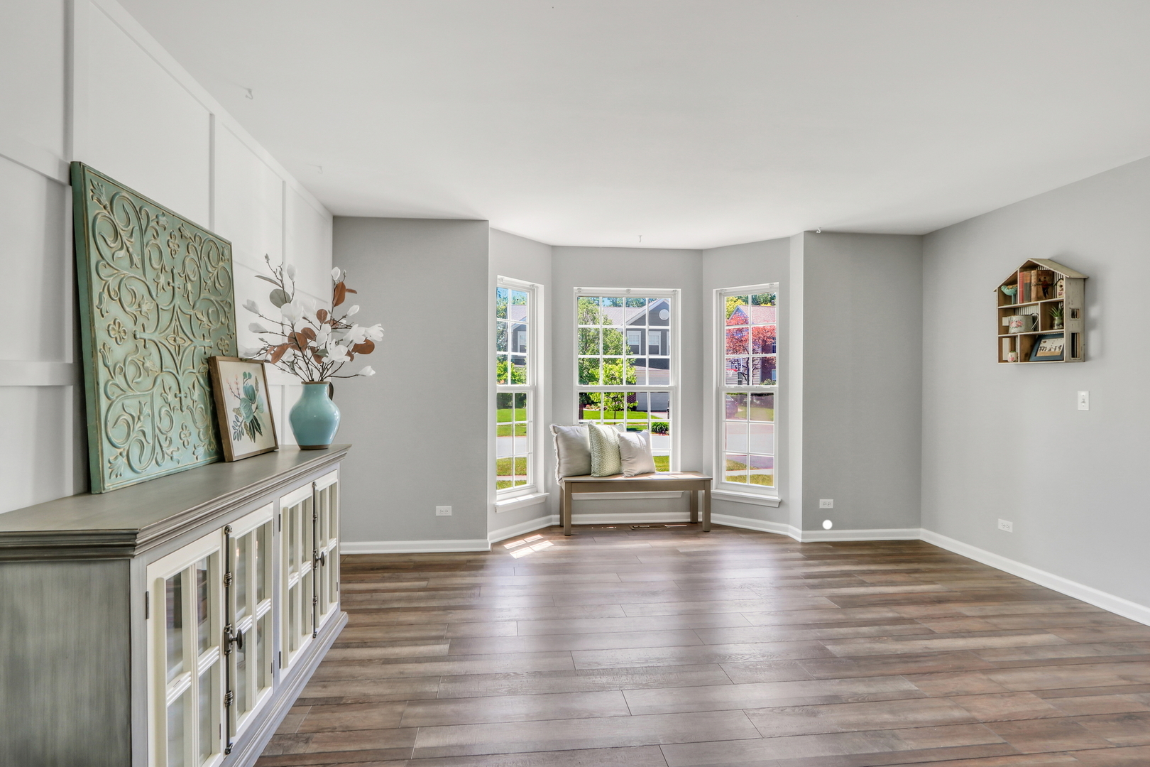 32 Highland Road Grayslake, IL 60030 - Photo 4 of 39 a view of an empty room with wooden floor and a window