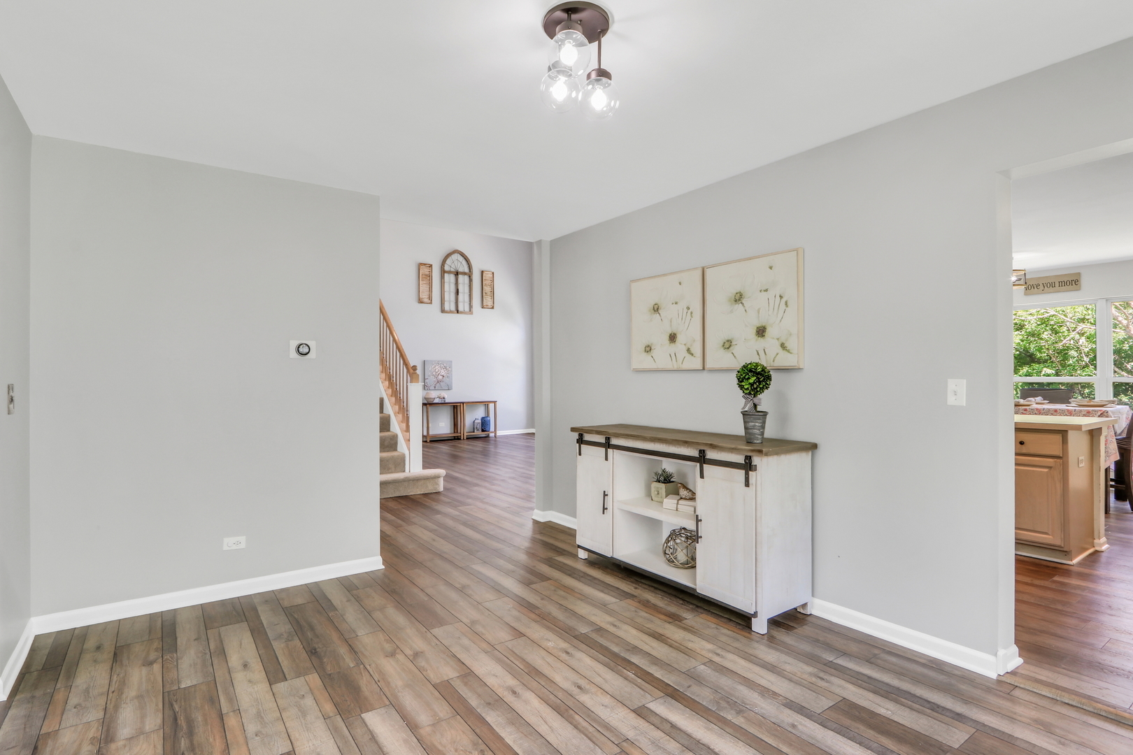 32 Highland Road Grayslake, IL 60030 - Photo 7 of 39 a view of a hallway with wooden floor and workspace