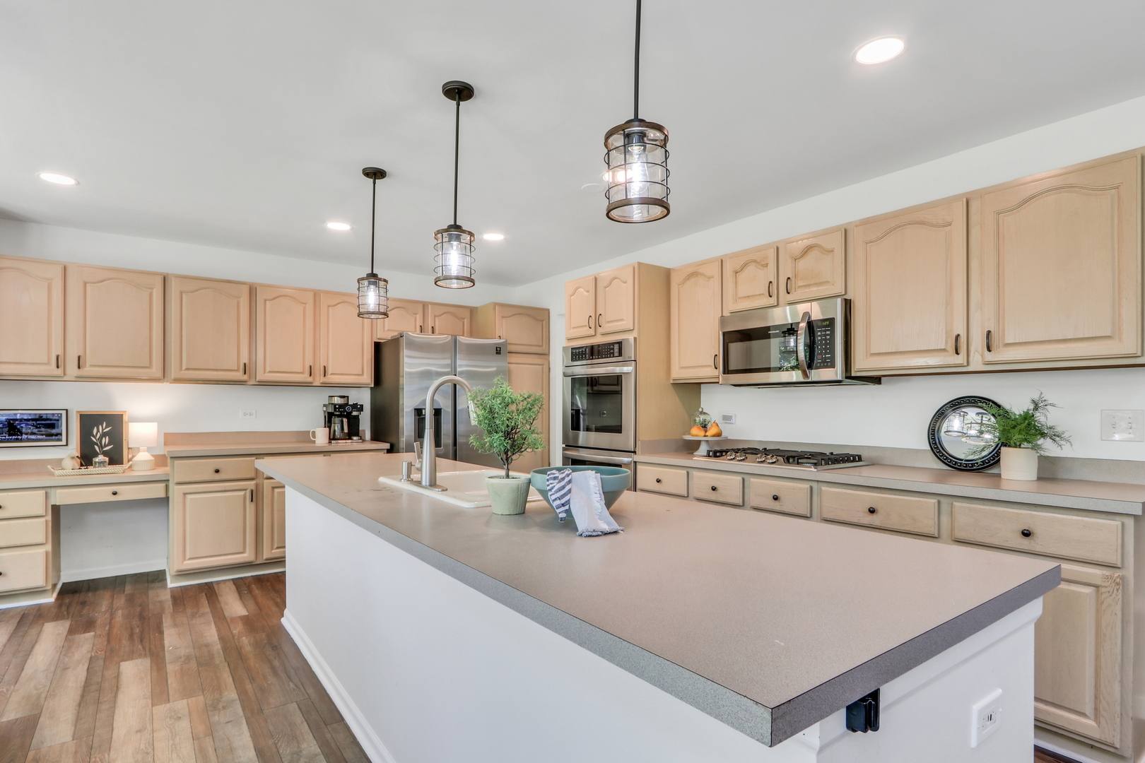 32 Highland Road Grayslake, IL 60030 - Photo 10 of 39 a kitchen with stainless steel appliances granite countertop a sink a stove and cabinets