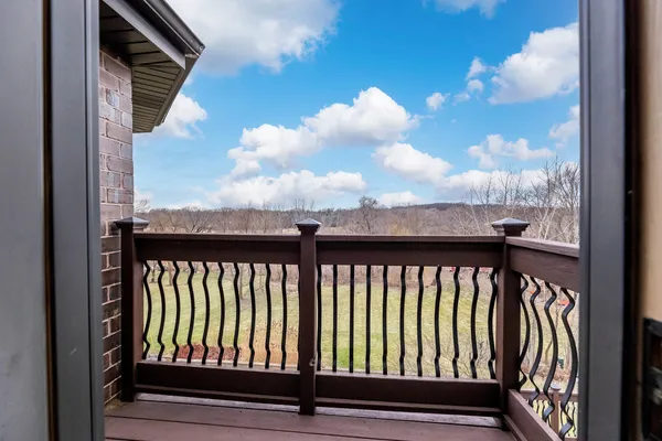 a large kitchen with a large window and stainless steel appliances