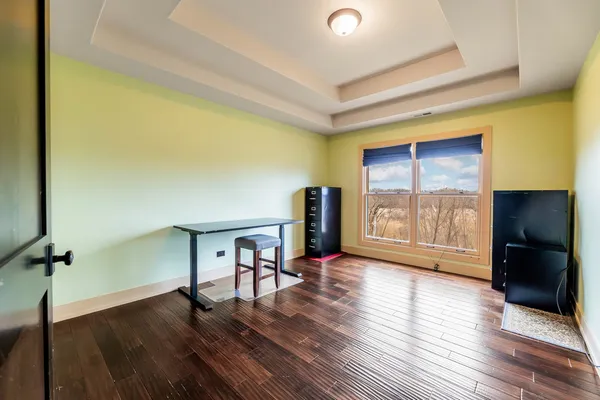 a bathroom with a granite countertop sink mirror vanity and toilet