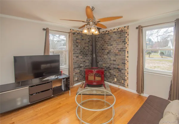 a room with furniture and flat screen tv