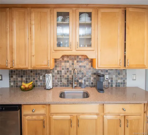 a kitchen with a sink and cabinets