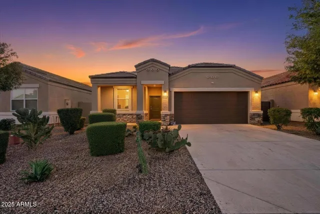 a front view of a house with garden