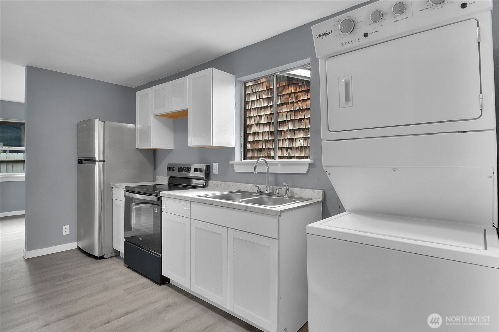 a kitchen with a stove and a refrigerator