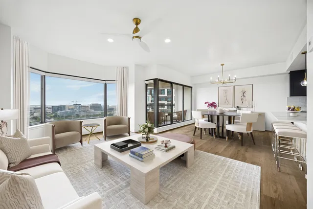 a living room with furniture and a table