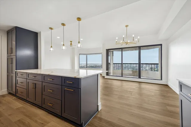 a spacious bathroom with a large tub and sink