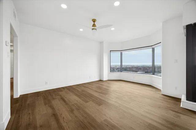 a view of a kitchen with a sink and a refrigerator