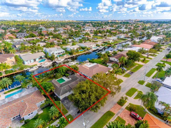 an aerial view of residential houses with outdoor space