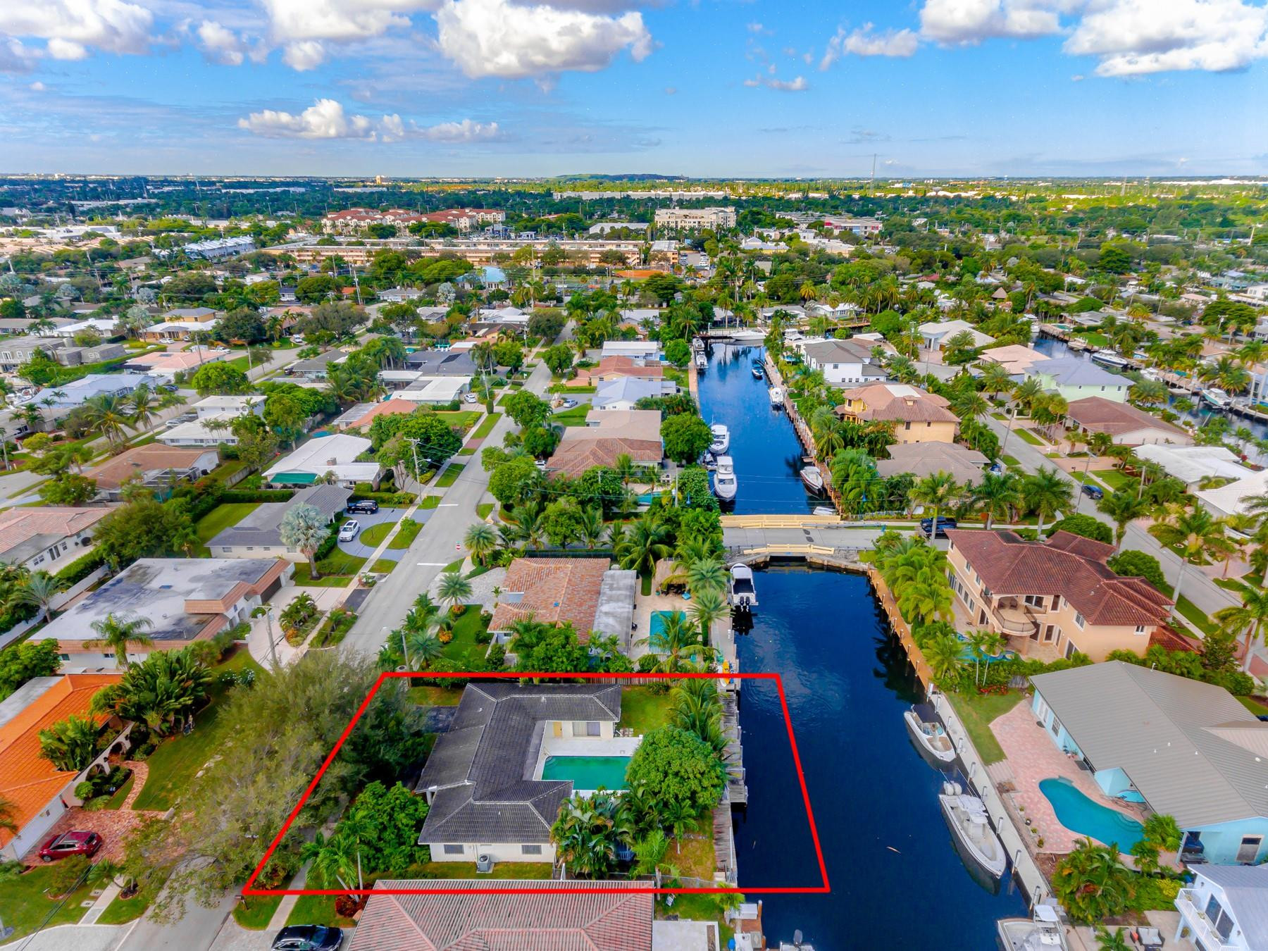 2411 Northeast 46th Street Lighthouse Point, FL 33064 - Photo 3 of 12 an aerial view of residential houses with outdoor space and trees