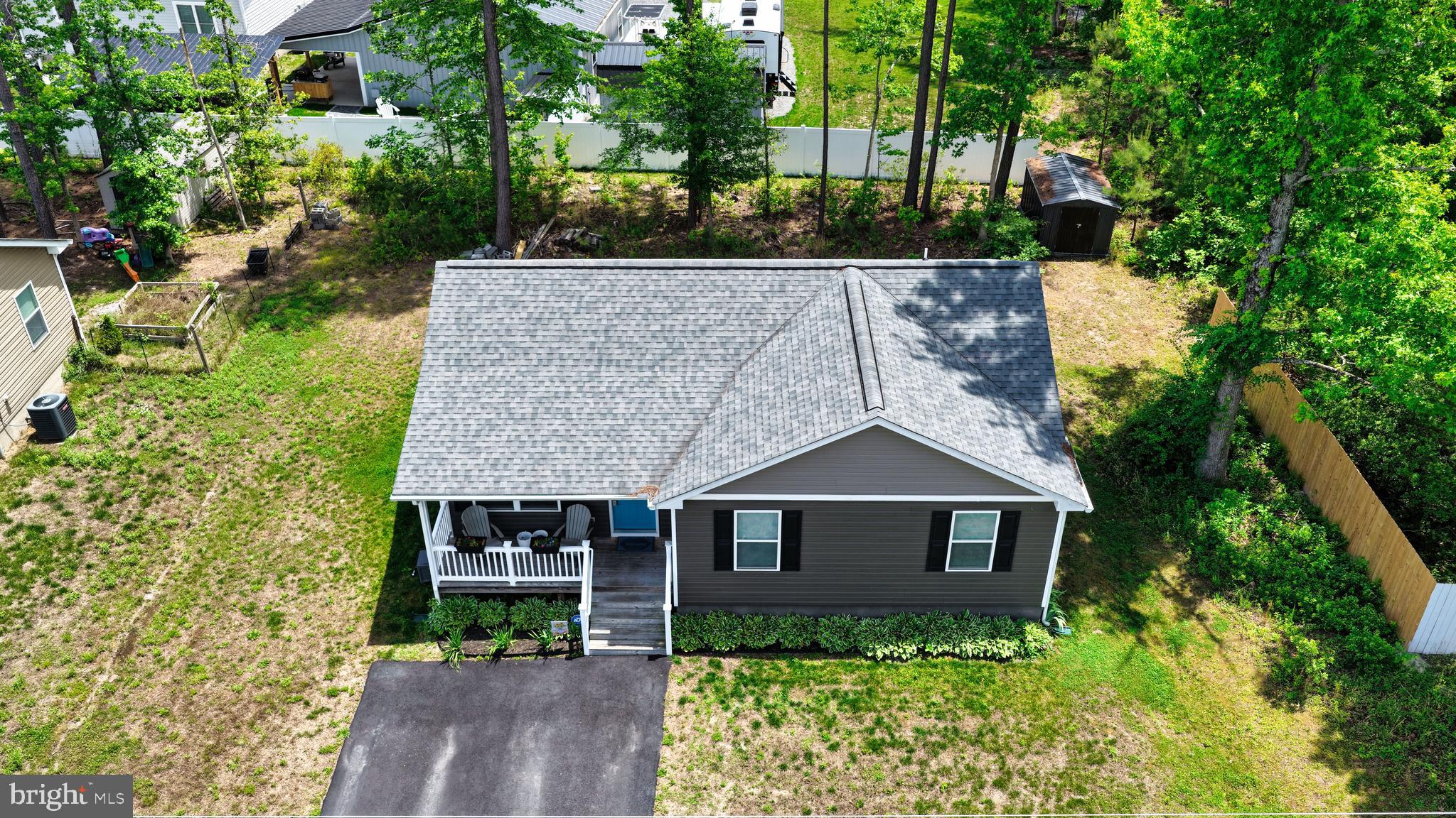 48 Rustic Lane Colonial Beach, VA 22443 - Photo 12 of 47 a front view of a house with garden