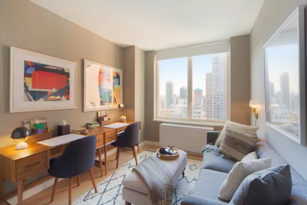 a living room with furniture and a window