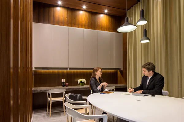a kitchen with a table and chairs