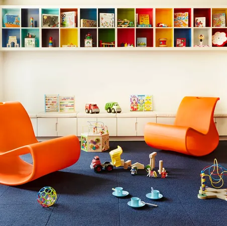 a room with furniture toys and a book shelf